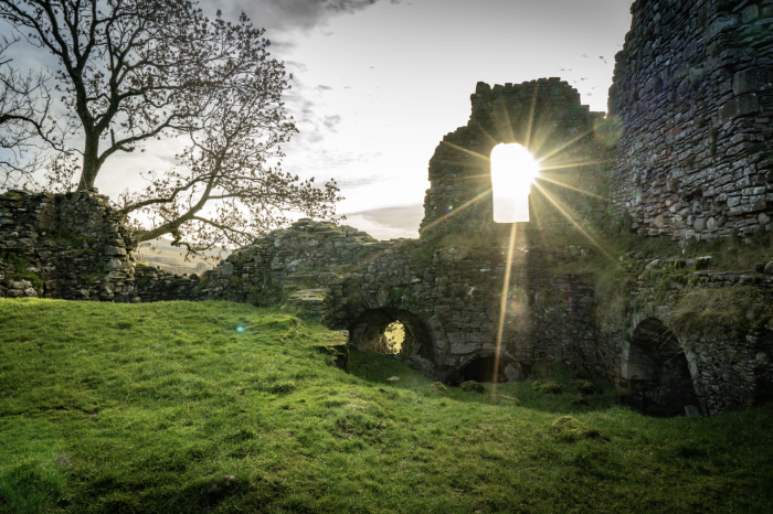 Photograph of a medieval castle with sunlight
